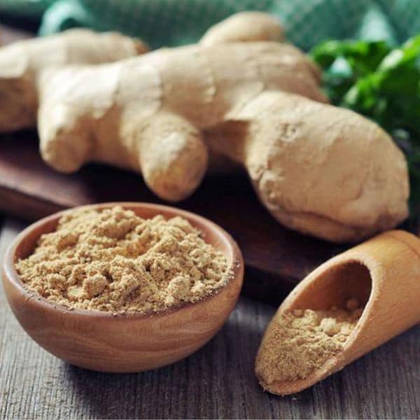 Ginger powder in a bowl with scoop
